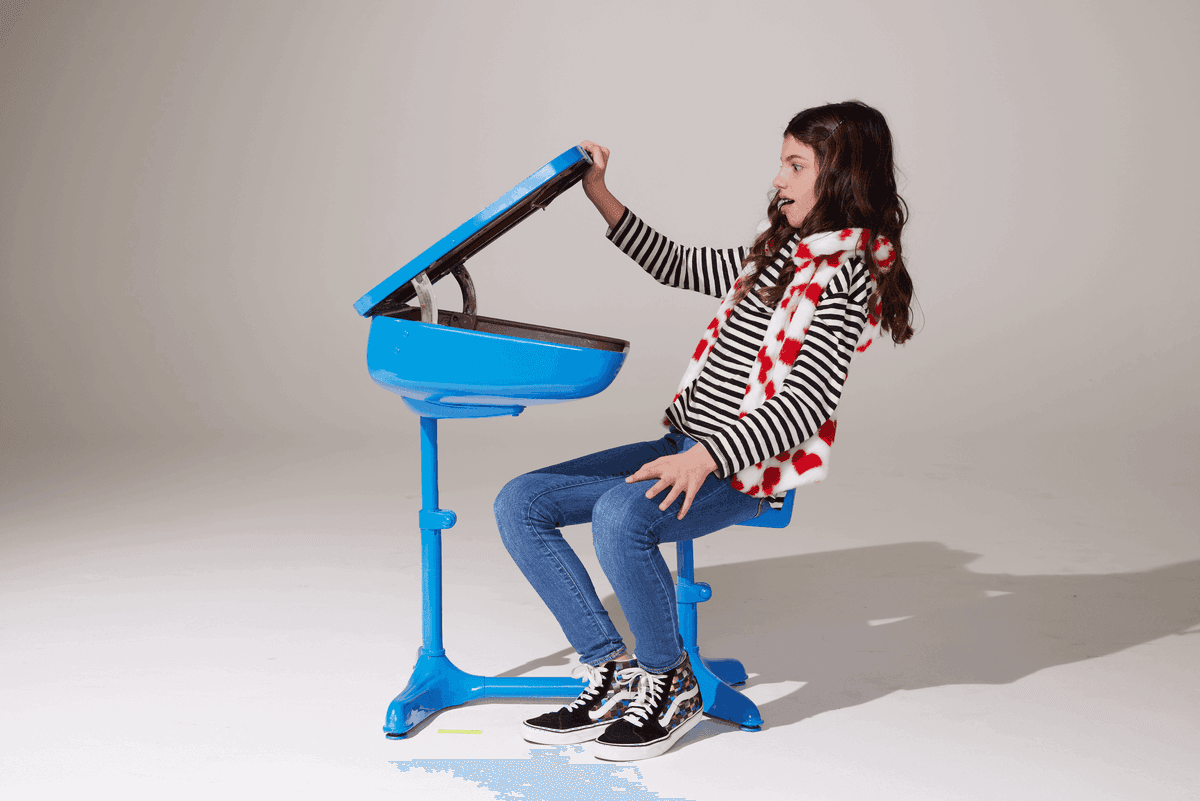 Girl at blue desk - studio photoshoot